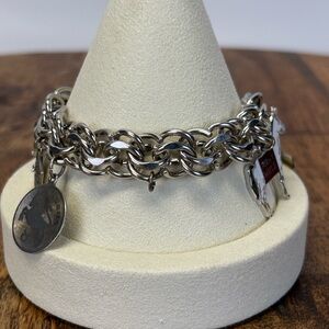 Double link Sterling Silver Charm Bracelet. With 5 charms.